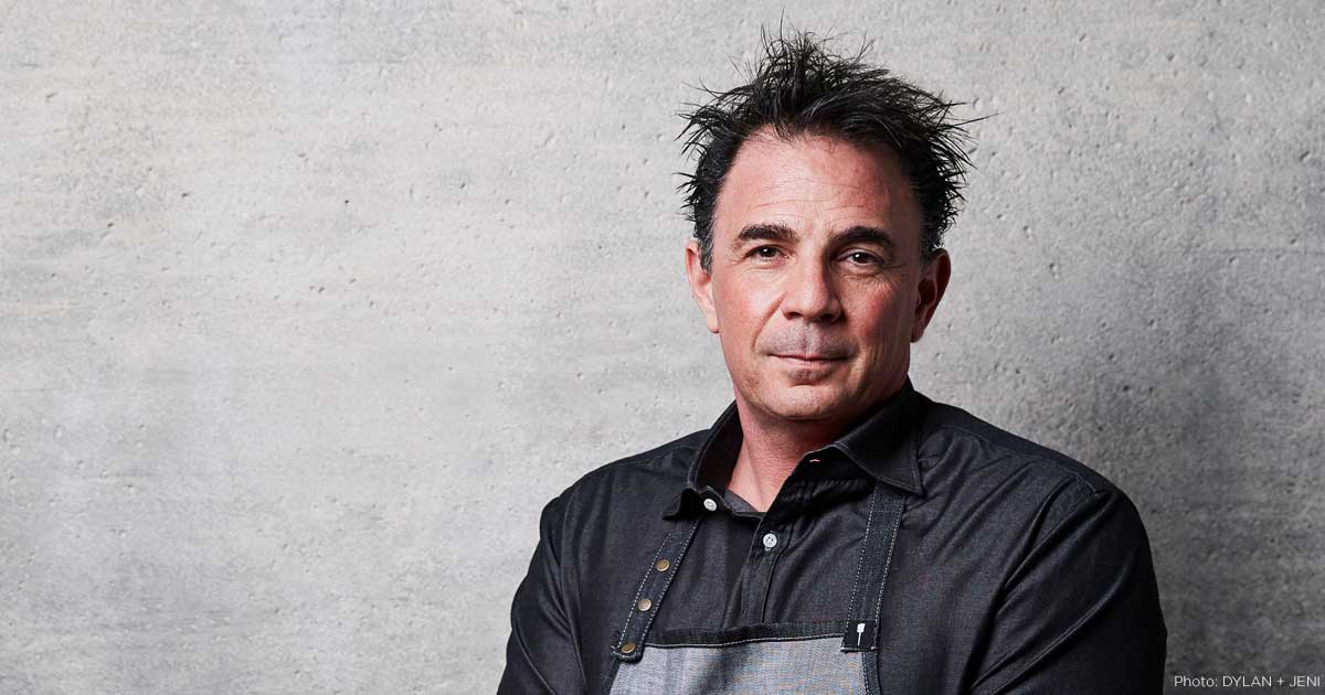 chef josiah citrin against a grey wall
