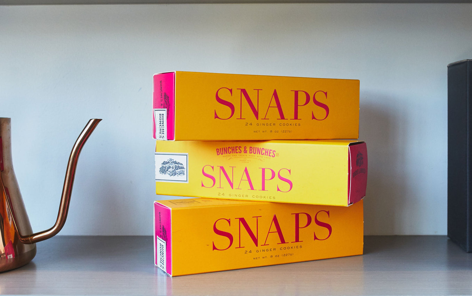 a stack of three boxes of ginger snaps.