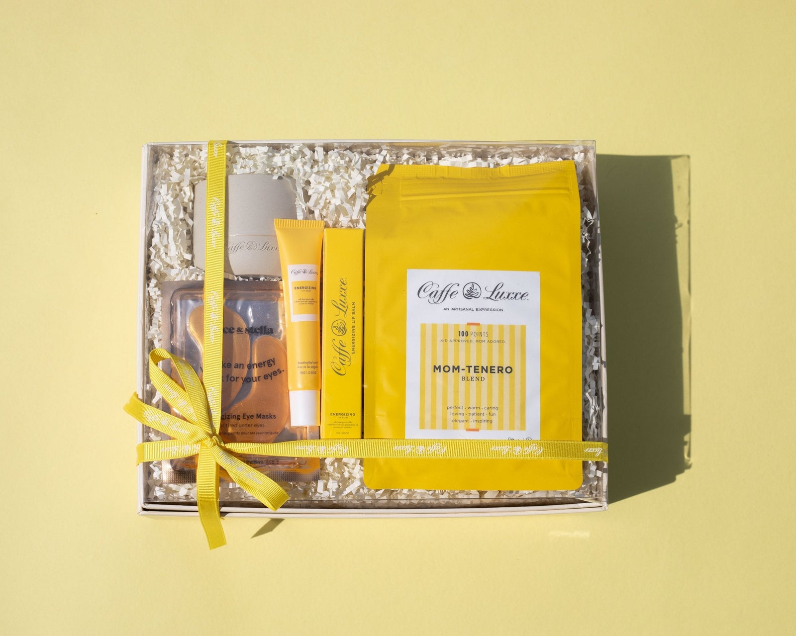 Gift set with Caffe Luxe products on a yellow background