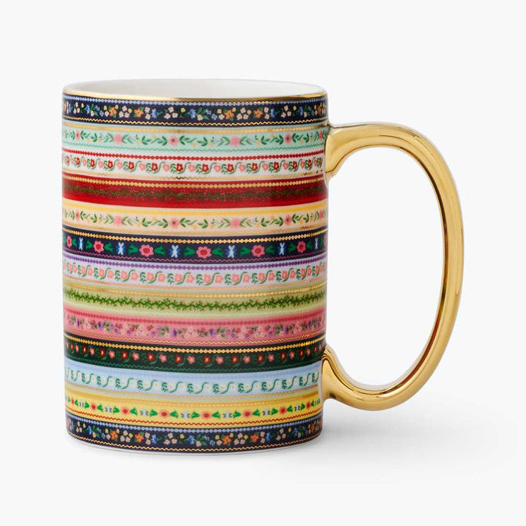 Colorful striped mug with a gold handle on a white background