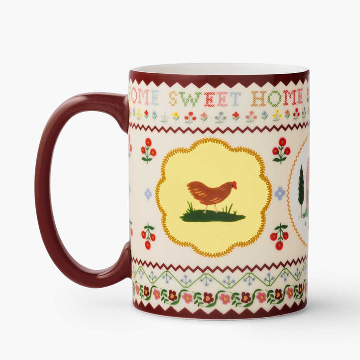 Mug with a chicken design and 'Home Sweet Home' text on a white background