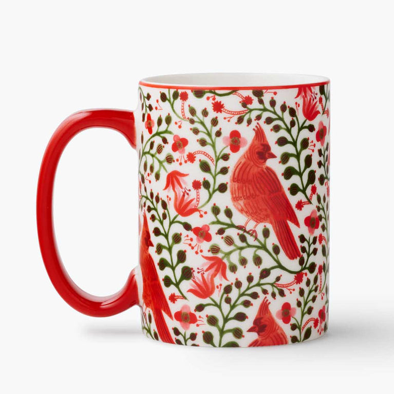 Mug with red cardinal and floral design on a white background