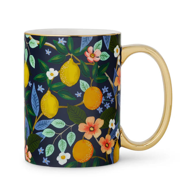 Mug with floral and fruit design on a white background